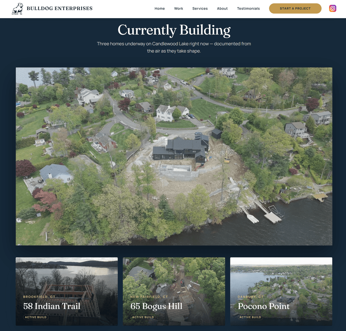 Bulldog's Currently Building page — an aerial photograph of an active lakefront build above three project cards marked active build